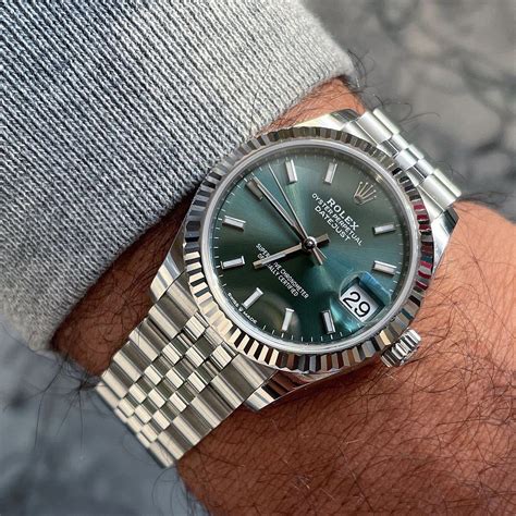 silver and green rolex